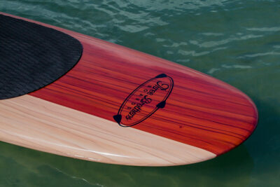 three brothers boards wood paddle boards 70-30 nose detail on the water