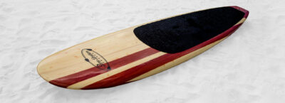 three brothers boards wood paddle boards irish twin on the sand