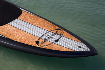 three brothers boards wood paddle boards rico nose detail on the water